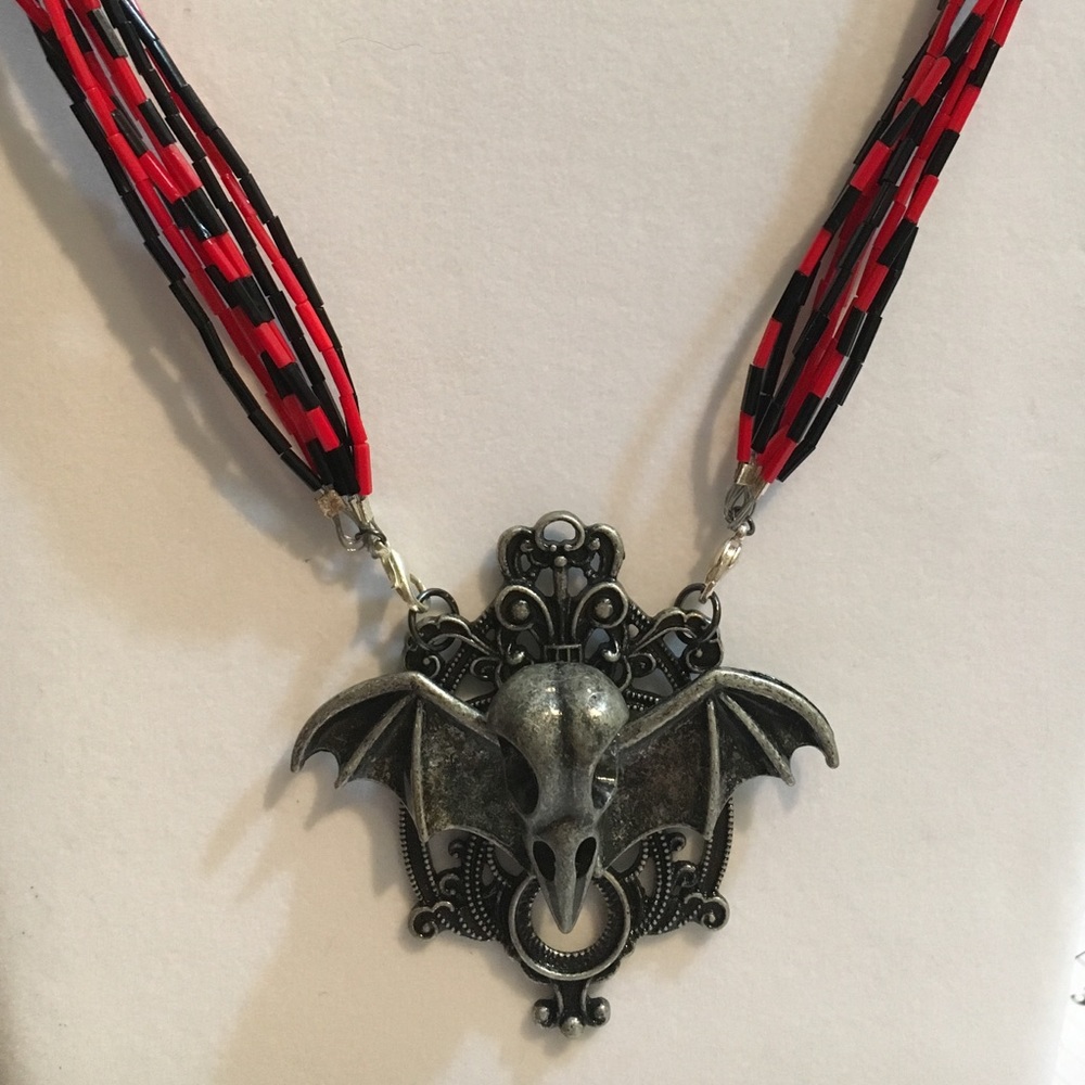 Bird skull and batwing necklace